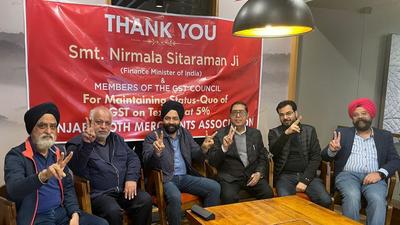 Members of Punjab Cloth Merchants Association appreciating the decision to defer the hike in GST rate on garments in Ludhiana on December 31, 2021. (HT PHOTO) Members of Punjab Cloth Merchants Association appreciating the decision to defer the hike in GST rate on garments in Ludhiana on December 31, 2021. (HT PHOTO)