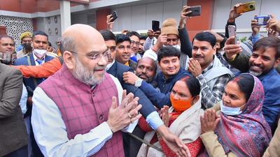 Union home minister Amit Shah greeting BJP workers in Lucknow. (PTI) Union home minister Amit Shah greeting BJP workers in Lucknow. (PTI)