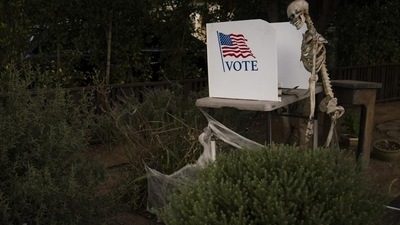 A skeleton stands next to a mock polling booth as part of Halloween decoration in Pasadena, Calif., Saturday, October 31, 2020, as in-person voting started for most California counties this weekend. (AP Photo/Jae C. Hong) A skeleton stands next to a mock polling booth as part of Halloween decoration in Pasadena, Calif., Saturday, October 31, 2020, as in-person voting started for most California counties this weekend. (AP Photo/Jae C. Hong)