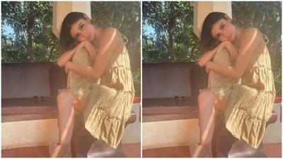 The midriff-baring dress came with slip-in details. Mouni paired it with matching slippers. (Instagram/@imouniroy)