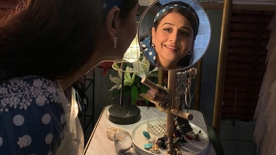 Vidya layered it with a sheer white dupatta and pulled back her luscious tresses with a blue hairband that too sported white polka dots.(Instagram/balanvidya)