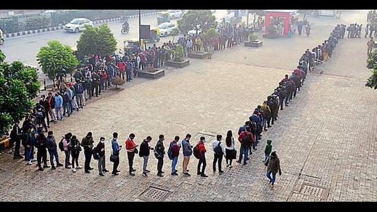 Long queues, like this one outside Akshardham Metro Station, are being seen across the city. (Photo: PTI)