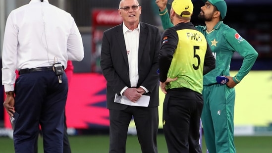 Dubai, Nov 11 (ANI): Australian skipper Aaron Finch and Pakistan Skipper Babar Azam at toss during the 2nd semi-final of ICC Men's T20 World Cup match between Australia and Pakistan, at Dubai International Cricket Stadium in Dubai on Thursday. (ANI Photo)(ANI)