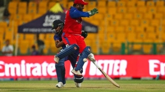 Afghanistan's Mohammad Shahzad collides with India's Hardik Pandya during the Cricket Twenty20 World Cup match between India and Afghanistan in Abu Dhabi, UAE, Wednesday, Nov. 3, 2021. (AP Photo/Aijaz Rahi)(AP)
