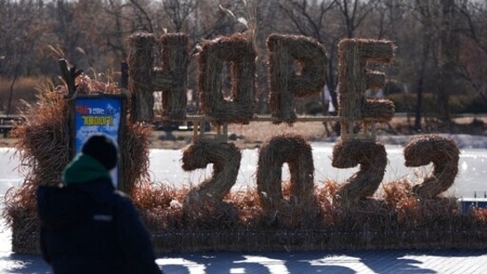 A man looks at the decorations for the coming 2022 Year on New Year's Eve in Seoul, South Korea, Friday, Dec. 31, 2021. (AP Photo/Lee Jin-man)
