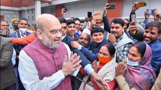 Union home minister Amit Shah greeting BJP workers in Lucknow. (PTI)