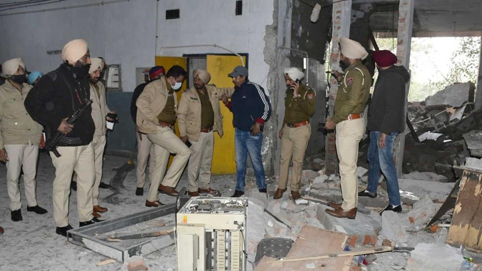 Police inspect the site of an explosion at the district court complex in Ludhiana, Punjab. (PTI) Police inspect the site of an explosion at the district court complex in Ludhiana, Punjab. (PTI)