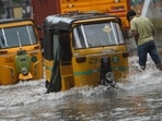 Tamil Nadu's capital Chennai and nearby areas witnessed heavy rainfall on the last two days of 2021. In picture - Auto-rickshaws make their way along a waterlogged street after a heavy rainfall in Chennai. Tamil Nadu's capital Chennai and nearby areas witnessed heavy rainfall on the last two days of 2021. In picture - Auto-rickshaws make their way along a waterlogged street after a heavy rainfall in Chennai.