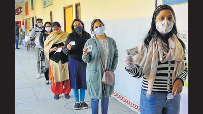 People showing their voting ID cards, Panchkula , December 27, 2020 (Keshav Singh/HT Photo) People showing their voting ID cards, Panchkula , December 27, 2020 (Keshav Singh/HT Photo)