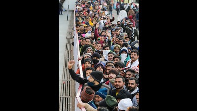 Devotees wait to purchase tickets to visit the Vaishno Devi shrine, in Reasi district on Saturday. (PTI)