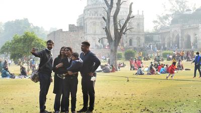 Visitors enjoy a sunny day at Lodhi Garden on Saturday. The minimum temperature in Delhi rose marginally to 4.2°C. IMD has predicted rain in Delhi from January 5. The AQI also worsened by stayed in very poor zone. (Arvind Yadav) Visitors enjoy a sunny day at Lodhi Garden on Saturday. The minimum temperature in Delhi rose marginally to 4.2°C. IMD has predicted rain in Delhi from January 5. The AQI also worsened by stayed in very poor zone. (Arvind Yadav)