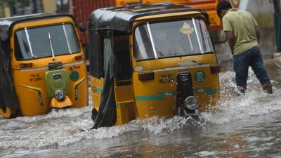 Tamil Nadu's capital Chennai and nearby areas witnessed heavy rainfall on the last two days of 2021. In picture - Auto-rickshaws make their way along a waterlogged street after a heavy rainfall in Chennai. (AFP) Tamil Nadu's capital Chennai and nearby areas witnessed heavy rainfall on the last two days of 2021. In picture - Auto-rickshaws make their way along a waterlogged street after a heavy rainfall in Chennai. (AFP)