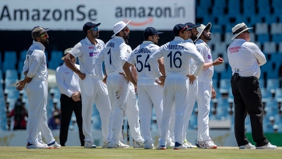 Umpire Marais Erasmus of South Africa, far right, with India's players watch a review on an electronic screen after requested by South Africa's captain Dean Elgar after dismissed for LBW, during the fifth day of the Test Cricket match between South Africa and India at Centurion Park in Pretoria, South Africa, Thursday, Dec. 30, 2021 (AP)