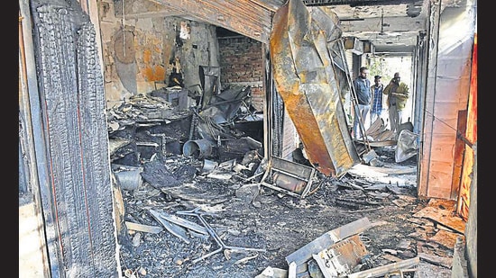 Two businessmen, whose shops were also consumed by the rapidly spreading flames in Ferozepur Market, Ludhiana , have sought an FIR against the owner of the Vada Pav eatery, where the flames allegedly broke out, and the PSPCL. (Harsimar Pal Singh/HT)