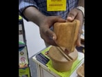 Screengrab from the video of rice bran containers that was retweeted by Shashi Tharoor. Screengrab from the video of rice bran containers that was retweeted by Shashi Tharoor. 
