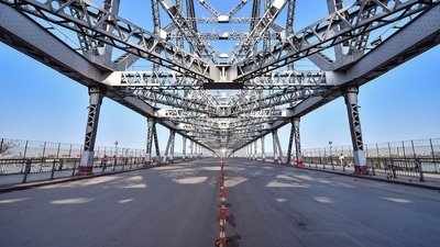 The Howrah Bridge bears a deserted look during the coronavirus disease (Covid-19)-necessitated lockdown in Kolkata earlier last year. (File Photo / PTI) The Howrah Bridge bears a deserted look during the coronavirus disease (Covid-19)-necessitated lockdown in Kolkata earlier last year. (File Photo / PTI)