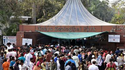 People flouting social distancing norms at the entrance of Nehru Zoological park, amid the spike in Covid-19 cases, in Hyderabad on Sunday. (ANI) People flouting social distancing norms at the entrance of Nehru Zoological park, amid the spike in Covid-19 cases, in Hyderabad on Sunday. (ANI)