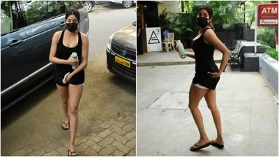 Janhvi added a touch of suave to her simple all-black attire at the gym today, January 2. The paparazzi clicked her entering the gym, and the pictures are taking over online. She chose a strappy black tank top featuring a deep U neckline and a bodycon fit. (HT Photo/Varinder Chawla)