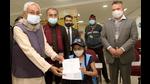 Chief minister Nitish Kumar presents a Covid vaccination certificate to a student after she receives her first dose of Covid-19 vaccine, at IGIMS, in Patna on Monday. (Santosh Kumar/HT Photo) Chief minister Nitish Kumar presents a Covid vaccination certificate to a student after she receives her first dose of Covid-19 vaccine, at IGIMS, in Patna on Monday. (Santosh Kumar/HT Photo)