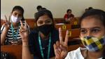 Navi Mumbai, India - January 03, 2022: Students of ICLES' Motilal Jhunjhunwala College flash a victory sign after getting inoculated against COVID-19 during a special vaccination drive for teenagers in the 15-18 age group in Vashi, Navi Mumbai, India, on Monday, January 03, 2022. (Photo by Bachchan Kumar/ HT PHOTO) (HT PHOTO) Navi Mumbai, India - January 03, 2022: Students of ICLES' Motilal Jhunjhunwala College flash a victory sign after getting inoculated against COVID-19 during a special vaccination drive for teenagers in the 15-18 age group in Vashi, Navi Mumbai, India, on Monday, January 03, 2022. (Photo by Bachchan Kumar/ HT PHOTO) (HT PHOTO)