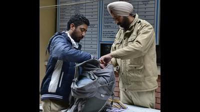 Police frisking visitors at the entrance of Ludhiana court complex on Monday. (Harsimar Pal Singh/HT) Police frisking visitors at the entrance of Ludhiana court complex on Monday. (Harsimar Pal Singh/HT)