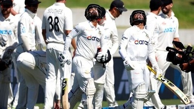 Bangladesh's captain Mominul Haque, right, with teammate Liton Das walk onto the field after tea during play on day three&nbsp; (AP)
