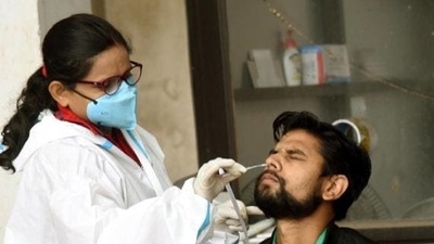 A health worker collects swab sample for Covid-19 testing in Patna on Sunday. (Santosh Kumar/HT File Photo) A health worker collects swab sample for Covid-19 testing in Patna on Sunday. (Santosh Kumar/HT File Photo)