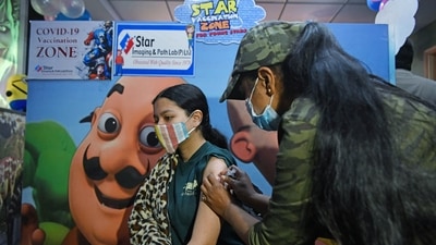 A girl receives a dose of Bharat Biotech's Covaxin against Covid-19 disease during a vaccination drive for children aged 15-18 years, in New Delhi on Monday. (ANI Photo)