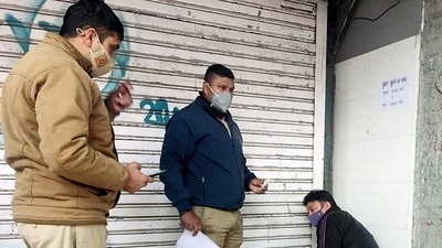 Police personnel sealing a shop for not following Covid-19 appropriate behaviour, at Malviya Nagar, in New Delhi on Sunday. (ANI Photo) Police personnel sealing a shop for not following Covid-19 appropriate behaviour, at Malviya Nagar, in New Delhi on Sunday. (ANI Photo)