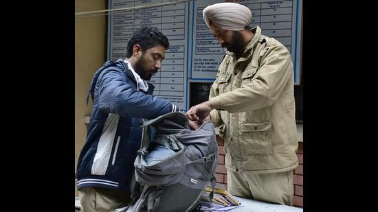 Police frisking visitors at the entrance of Ludhiana court complex on Monday. (Harsimar Pal Singh/HT)