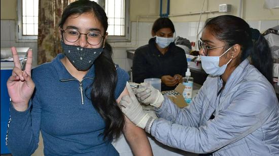 A medic administers Covid vaccine to a teen at urban community health centre, Ludhiana, on Monday. (Harsimar Pal Singh/HT)