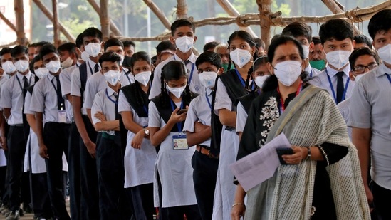 Children wait in queues to receive a dose of Bharat Biotech's COVID-19 vaccine, Covaxin, during a vaccination drive in Mumbai.(REUTERS)