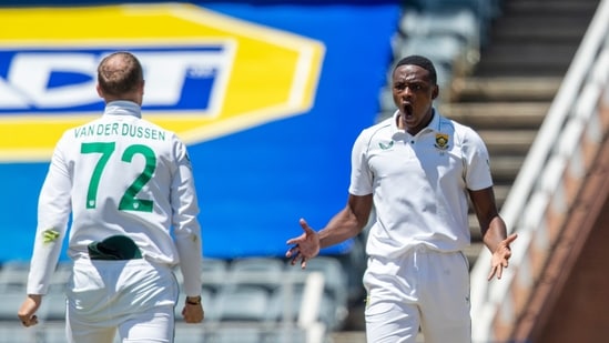 South Africa's bowler Kagiso Rabada, right, celebrates with teammate Rassie van der Dussen, for taking a catch to dismiss India's batsman Hanuma Vihari for 20 runs, during the first day of the 2nd Test Cricket match between South Africa and India at the Wanderers stadium in Johannesburg, South Africa, Monday, Jan. 3, 2022. (AP Photo/Themba Hadebe)(AP)