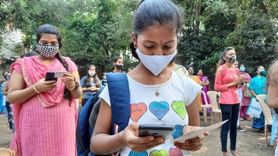 Thousands of children, many accompanied by parents, queued up outside schools, medical centres and special health camps from early on Monday to secure their first dose of a vaccine. 