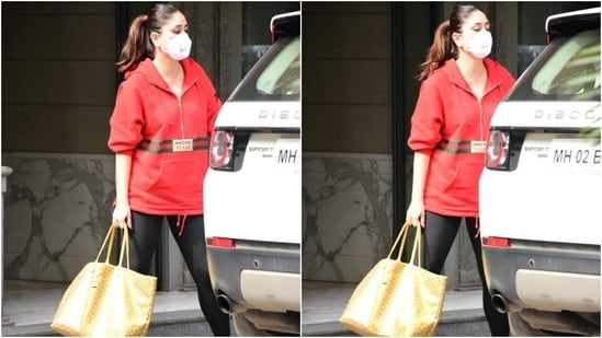 Kareena was clicked stepping out of her car wearing a bright red jacket. The glam piece is from the luxury label Gucci. It features a short zipper on the front, long sleeves, hoodie on the back, a loose-fitting to exude a casual vibe, and Gucci label and stripes.&nbsp;(HT Photo/Varinder Chawla)