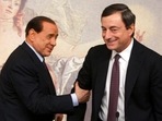 Premiers Silvio Berlusconi, left, and Mario Draghi, right, are seen during a press conference at Chigi Palace,in Rome. Premiers Silvio Berlusconi, left, and Mario Draghi, right, are seen during a press conference at Chigi Palace,in Rome.