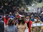 People throng Janpath Market amid a surge in Omicron cases, in New Delhi on Sunday.