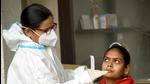 A health worker collects swab sample for Covid testing, in Patna on Tuesday. (Santosh Kumar/HT Photo) A health worker collects swab sample for Covid testing, in Patna on Tuesday. (Santosh Kumar/HT Photo)