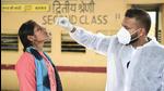 A health worker collects samples of a passenger at Dadar railway station in Mumbai on Wednesday (PTI) A health worker collects samples of a passenger at Dadar railway station in Mumbai on Wednesday (PTI)