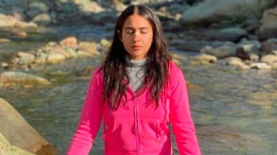 Fitness enthusiast Sara Ali Khan got on top of a rock, closed her eyes, folded her legs and performed the lotus yoga pose near a stream. (Instagram/@saraalikhan95)