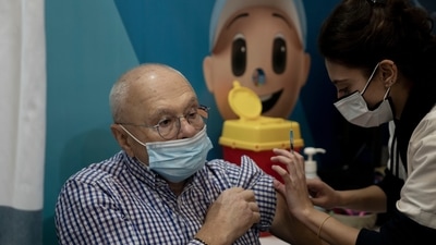 A man receives his fourth dose of the coronavirus vaccine in Jerusalem, on Monday. (AP Photo) A man receives his fourth dose of the coronavirus vaccine in Jerusalem, on Monday. (AP Photo)