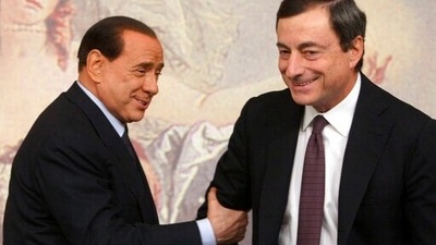 Premiers Silvio Berlusconi, left, and Mario Draghi, right, are seen during a press conference at Chigi Palace,in Rome. (AP) Premiers Silvio Berlusconi, left, and Mario Draghi, right, are seen during a press conference at Chigi Palace,in Rome. (AP)