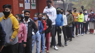 Beneficiaries in the 15-18 age group waiting to get vaccinated outside a centre in Sector 45, Chandigarh, on Tuesday. (Keshav Singh/HT)