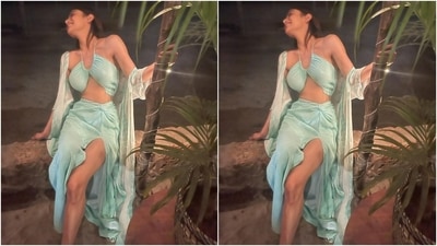Mouni teamed the bikini and skirt set with a flowy cape jacket adorned in blue and white tie-dye print pattern. She draped the half sleeve see-through cape on her shoulders. The star flaunted her statuesque frame in the chic ensemble. (Instagram/@imouniroy) Mouni teamed the bikini and skirt set with a flowy cape jacket adorned in blue and white tie-dye print pattern. She draped the half sleeve see-through cape on her shoulders. The star flaunted her statuesque frame in the chic ensemble. (Instagram/@imouniroy)