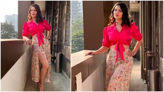 The gorgeous Sunny Leone, who never fails to impress the fashion police with her incredible style sense, recently took to her Instagram handle to share photos of herself in a beautiful pink polka-dotted knot crop top and thigh-high slit easy-breezy printed skirt.(Instagram/@sunnyleone)