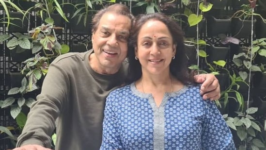 Dharmendra posed next to Hema Malini in the picture.