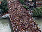 Image taken in 2020 of the Black Nazarene festival. Devotees carry the statue of the Black Nazarene to the carriage at the start of the annual religious procession in Manila, Philippines. Image taken in 2020 of the Black Nazarene festival. Devotees carry the statue of the Black Nazarene to the carriage at the start of the annual religious procession in Manila, Philippines.