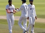 India's Jasprit Bumrah celebrates with KL Rahul after taking the wicket of South Africa's Keshav Maharaj .