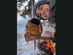The man and the raven posing after he wrapped a warm cloth around the bird. (Jukin Media) The man and the raven posing after he wrapped a warm cloth around the bird. (Jukin Media)