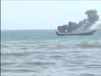 One of the boats set on fire during clashes between fishermen.(ANI Photo) One of the boats set on fire during clashes between fishermen.(ANI Photo)
